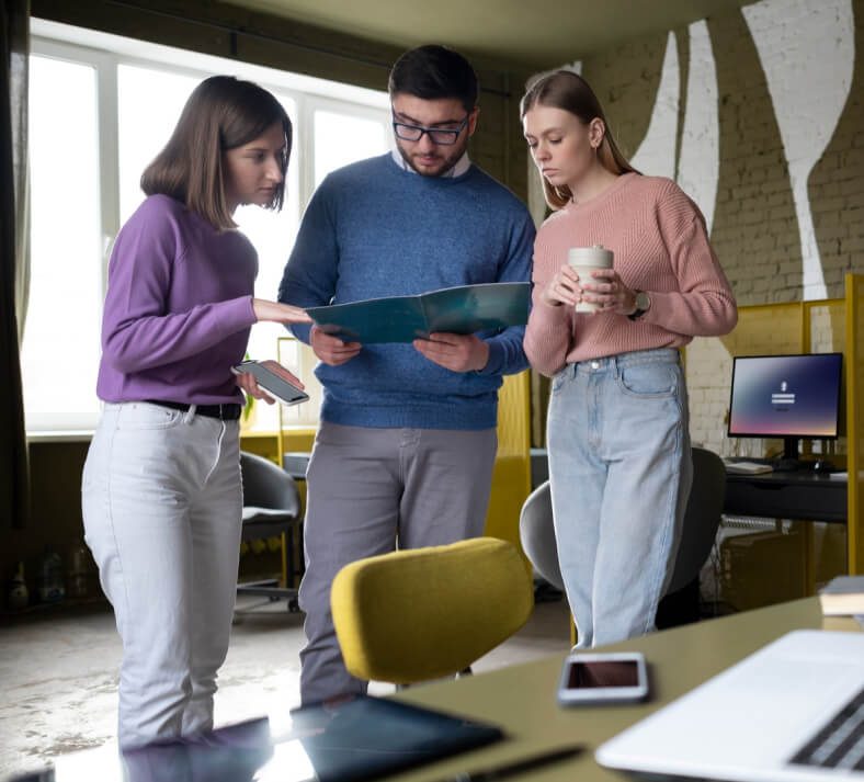 Colleagues examining a shared business document