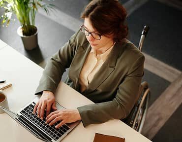 Professional organizing business inputs on a laptop